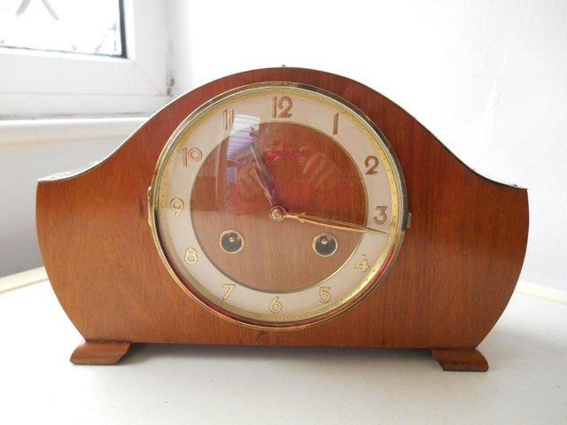 Preview of the first image of A brass topped striking Hermle mantle clock.