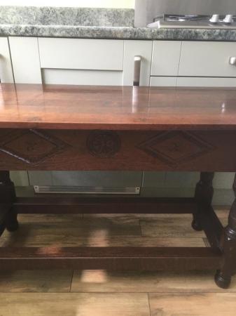Image 1 of A solid oak side table c 1920/1930.