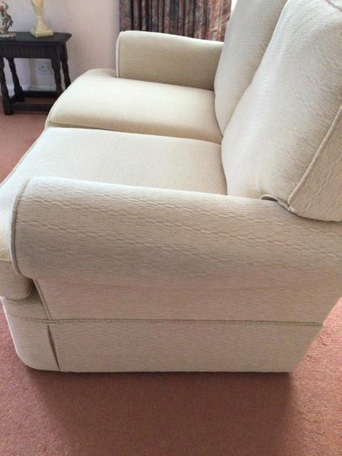 Preview of the first image of Cream two seater sofas for sale.
