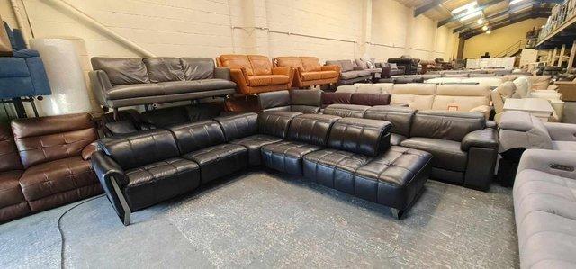 Preview of the first image of Ex-display Packham black leather recliner corner sofa.