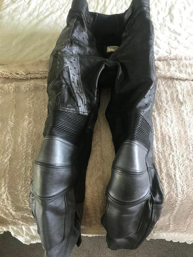 Preview of the first image of Black and silver Leather motorcycle pants.