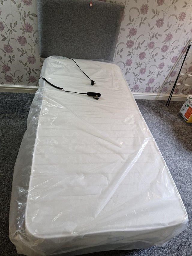 Preview of the first image of Electric controlled bed with unused mattress.