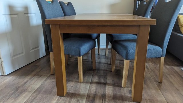 Image 1 of Solid Wood Dining Table and Four Fabric Chairs