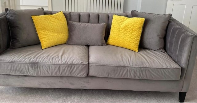 Preview of the first image of Grey three seater suede sofa.