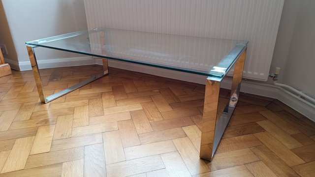 Preview of the first image of COFFEE TABLE WITH GLASS TOP.