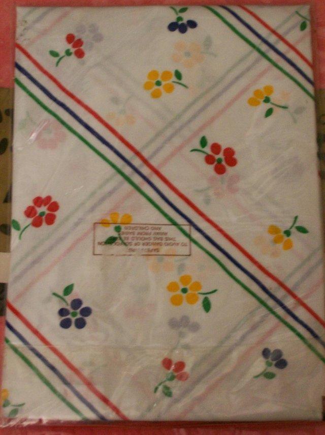Preview of the first image of New Pillowcase. White with Red, Green, Blue & Yellow Pattern.