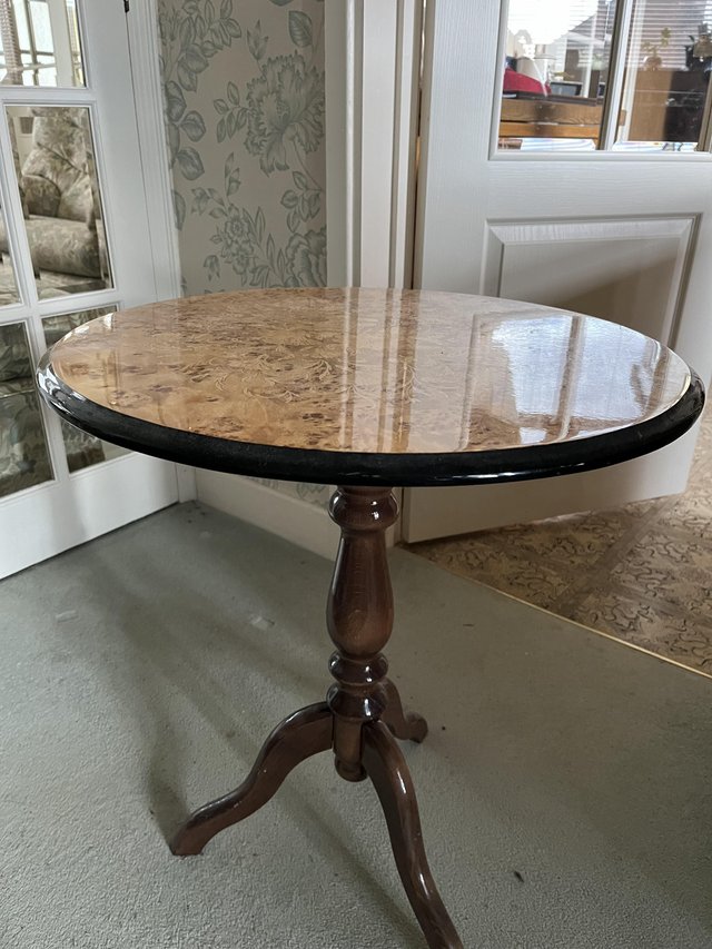 Preview of the first image of Small elegant table with attractive decorative finish.