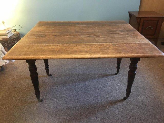 Preview of the first image of Antique oak Pembroke drop-leaf table.