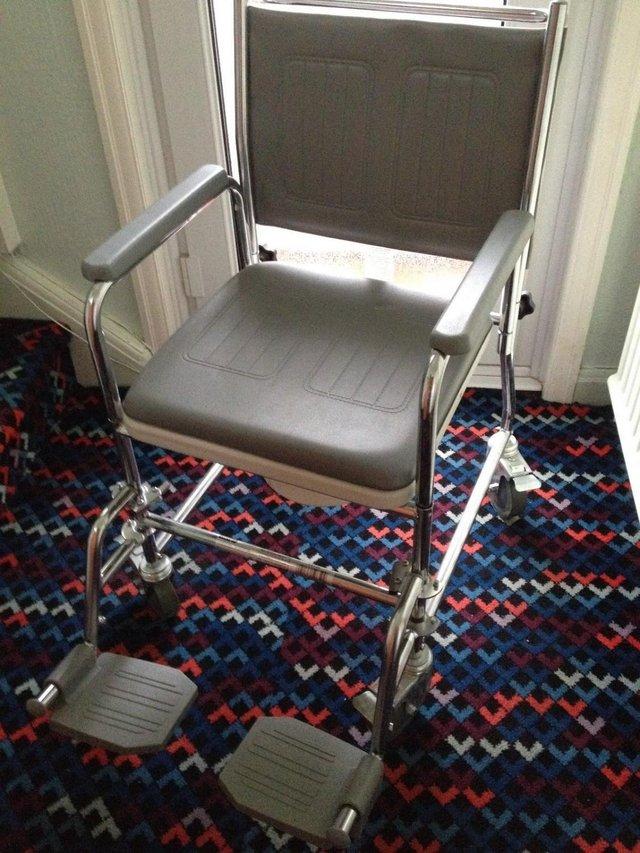 Preview of the first image of MOBILITY COMMODE WITH WHEELS & BRAKES.