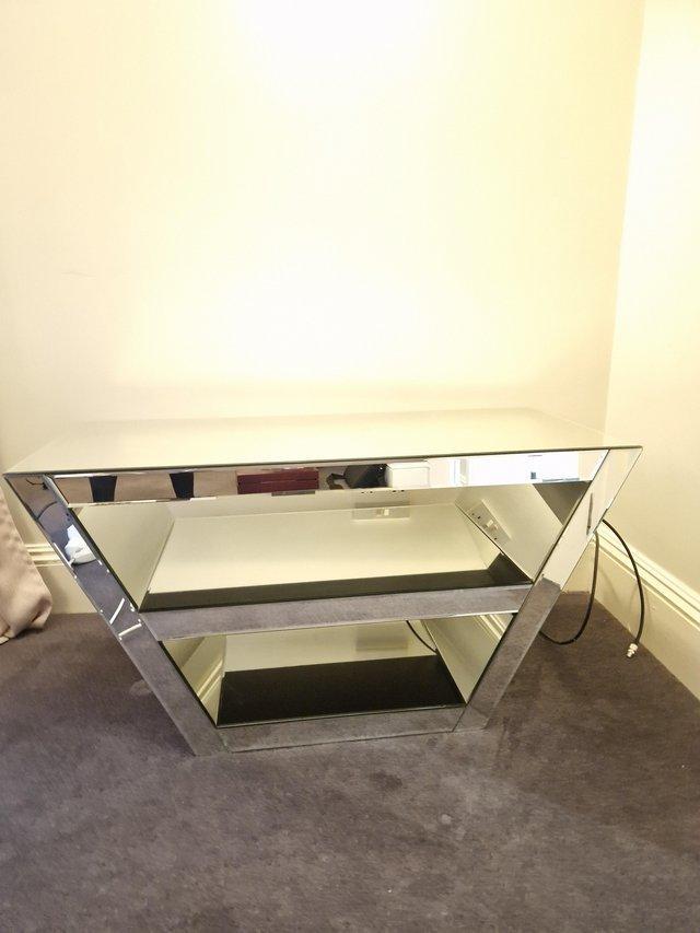 Preview of the first image of Mirrored TV Stand Like New 1 year old.