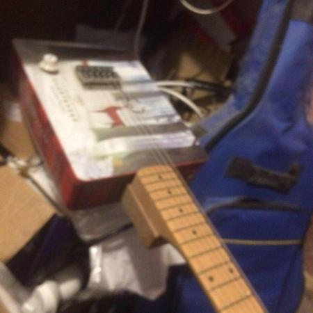 Image 1 of short cake tinsix string electric guitar.