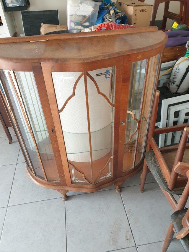 Preview of the first image of 1940's antique wooden glass cabinet.