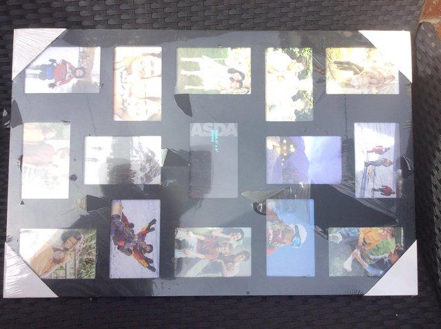 Preview of the first image of Photo frame wall hanging collage holds 6x4” pictures.