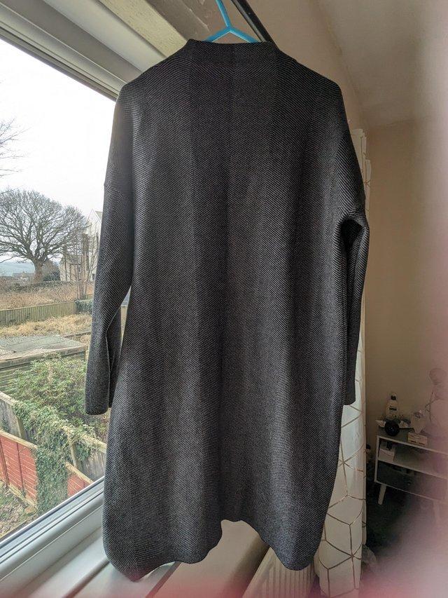Preview of the first image of Woman's grey jumper in perfect condition.