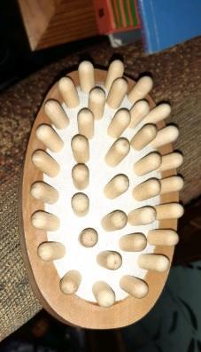 Preview of the first image of The Body Shop wooden hand massager.