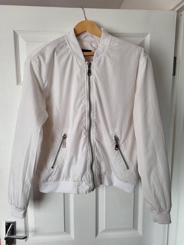 Preview of the first image of White Satin Feel Jacket With Silver Zippers.