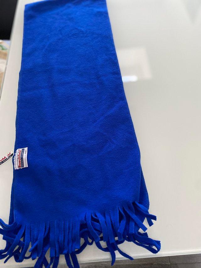 Preview of the first image of Blue scarf with tassels. Brand New.