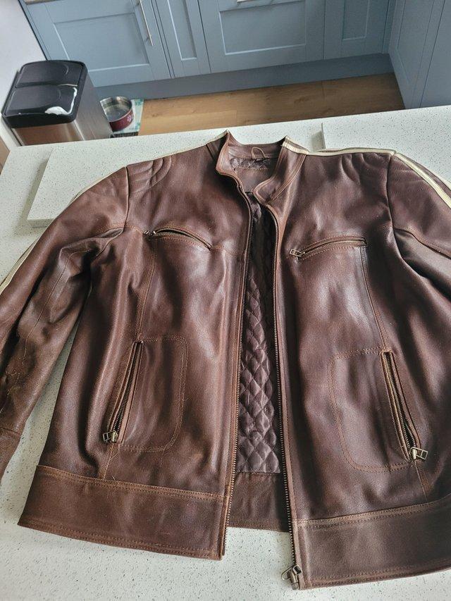 Preview of the first image of Brown leather jacket large size.