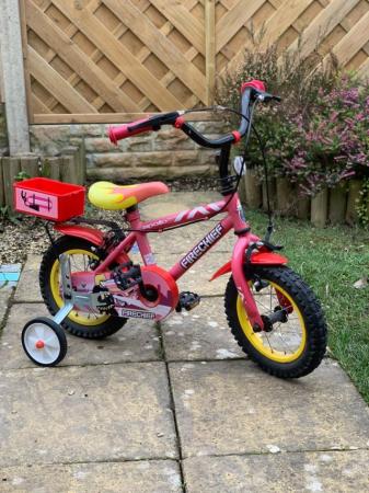 Image 1 of Child’s bike with new stabilisers.
