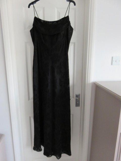 Preview of the first image of Roman black evening dress in size 16..