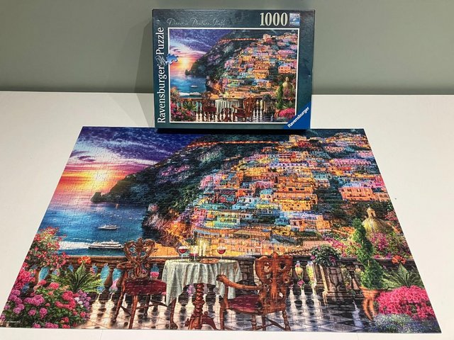 Preview of the first image of Ravensburger 1000 piece titled Dinner in Positano Italy.