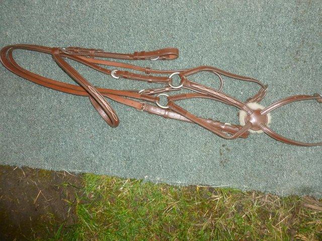 Preview of the first image of Brown English leather grackle bridle Cob to small full size.