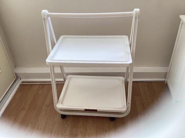 Preview of the first image of Tea trolly folds flat it’s on wheels and washable..