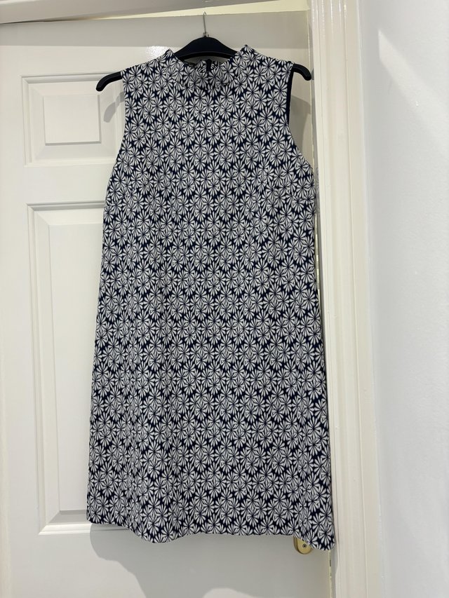 Preview of the first image of Dress from F&F, fully line blue with white pattern.