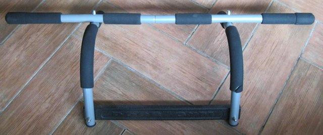 Preview of the first image of Door Gym - door frame pull up bar.