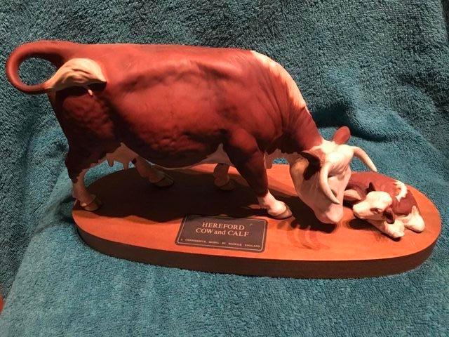 Preview of the first image of Beswick Hereford Bull Cow and Calf on wooden plinth.