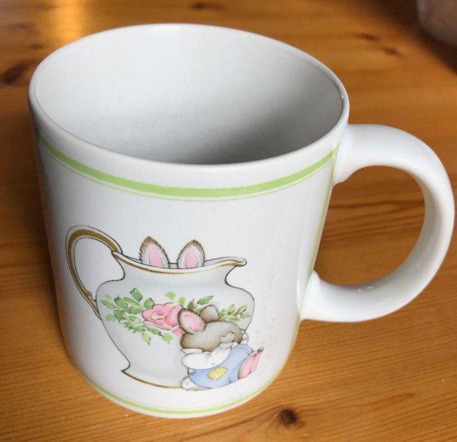 Preview of the first image of ANDREW BROWNSWORD CHINA MUG, WITH RABBITS PLAYING.