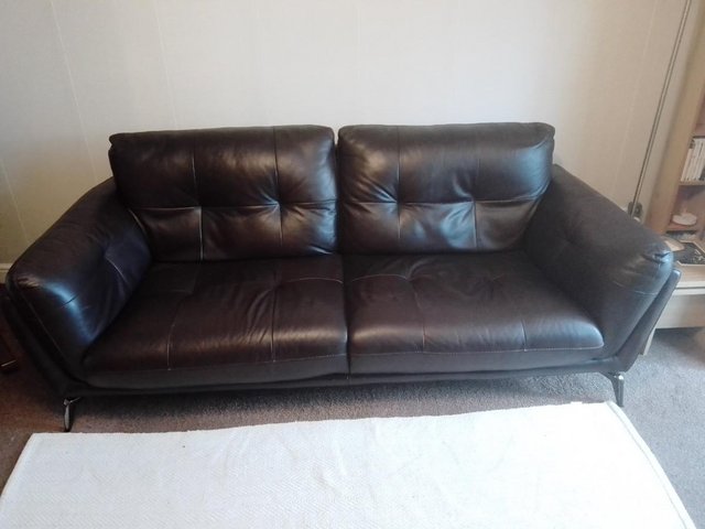 Preview of the first image of BLACK LEATHER 4 SEATER SETTEE WITH CHROME LEGS.