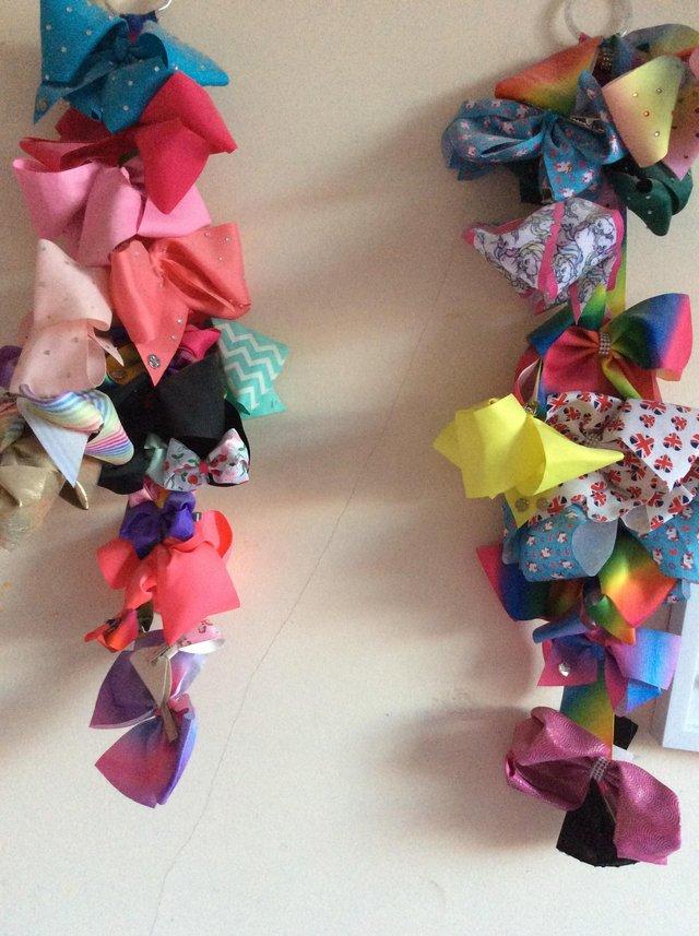 Preview of the first image of Assortment of colourful hair bows for dancewear/competitions.