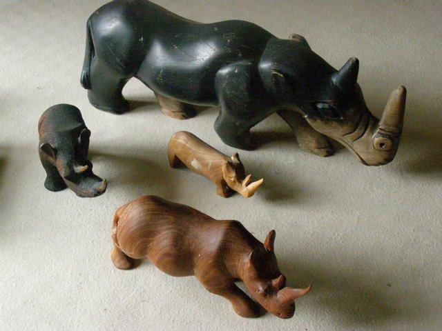 Preview of the first image of Carved wooden rhinos, a great selection.