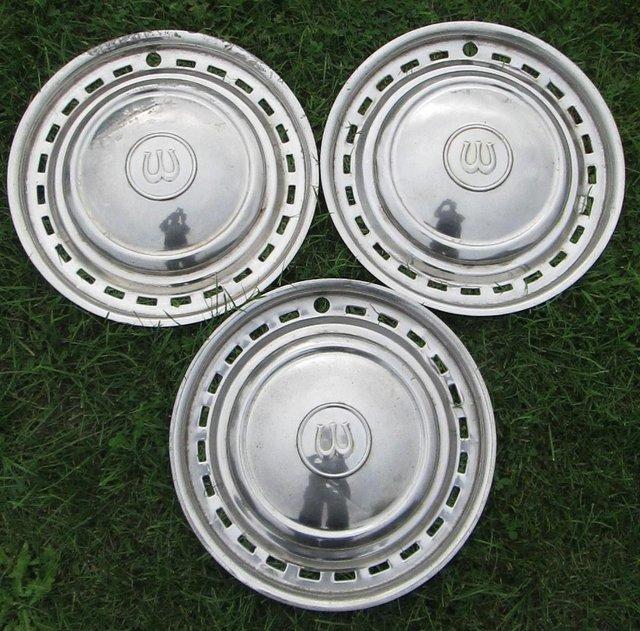 Preview of the first image of Three Wolseley chrome hub caps, 15" diameter..