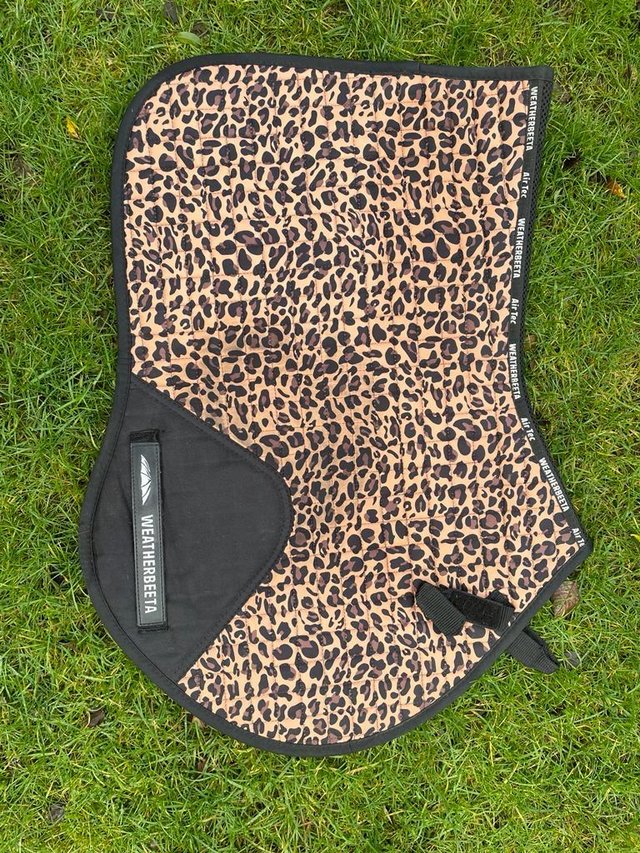 Preview of the first image of Weatherbeeta leopard print saddle pad.