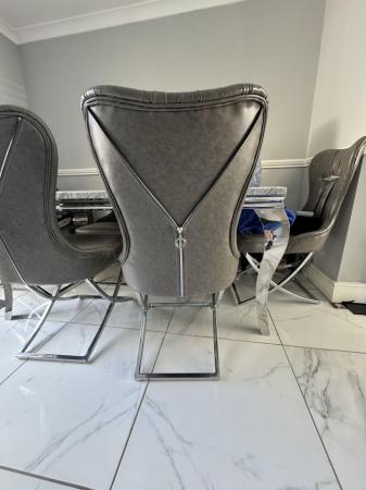 Image 1 of Solid marble dinging table with chrome frame/legs + 6 chairs
