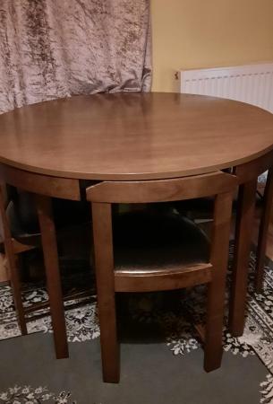 Image 1 of Round dining table and four chairs