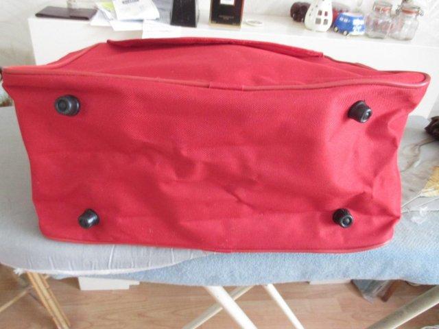 Preview of the first image of RED HOLDALL - NEW NEVER USED  - UNBRANDED.