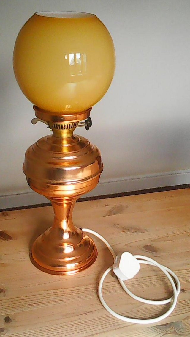Preview of the first image of Copper oil effect electric table lamp with glass shade.