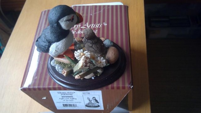 Preview of the first image of Puffin Bird ornament on wooden stand.