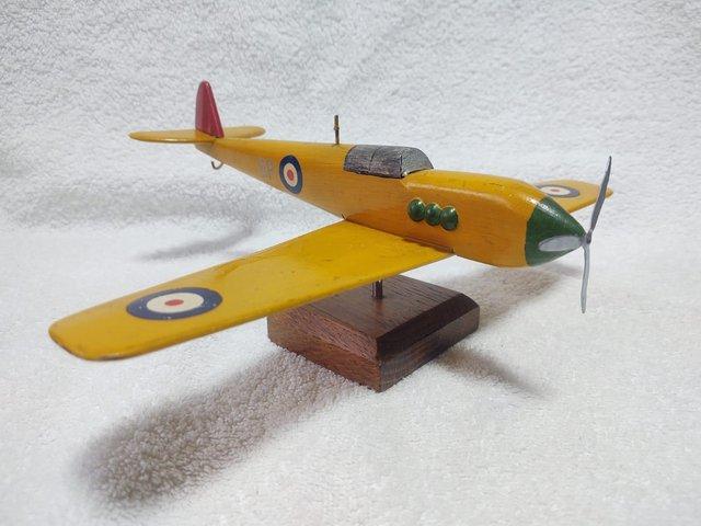 Preview of the first image of A Mounted Wooden Model War Plane.