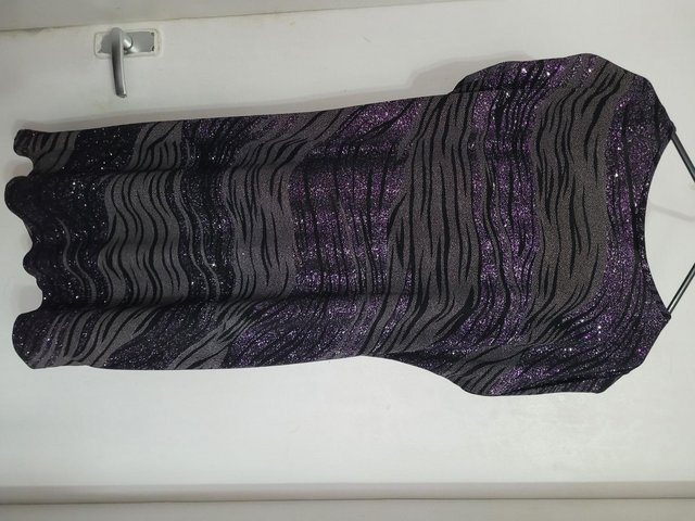 Preview of the first image of black and grey with purple sparkles tunic top. loose fitting.