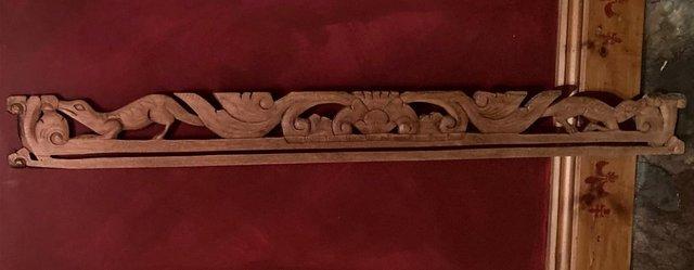 Preview of the first image of Carved wooden tapestry hanger..