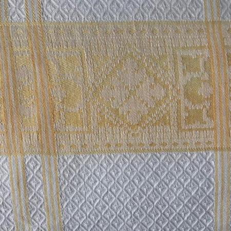 Image 2 of Vintage white & yellow patterned tablecloth. Approx 48" sq.