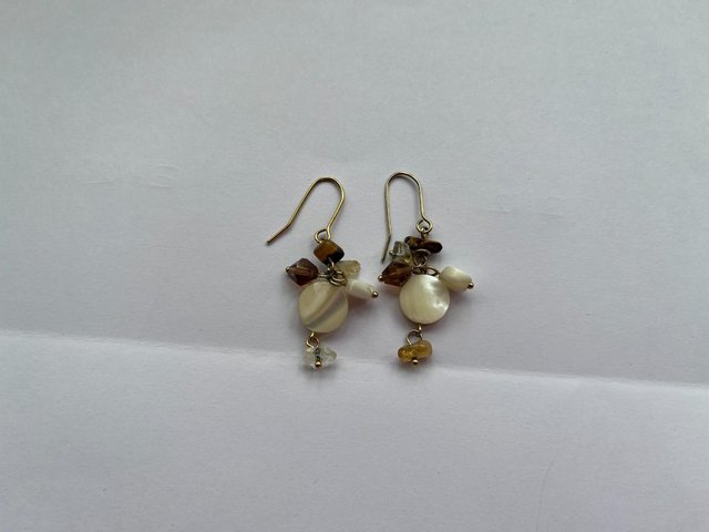 Preview of the first image of Cream & Brown 2 pairs of earrings.