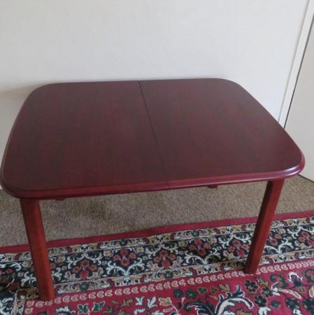 Image 2 of Extendable Mahogany colour dining table