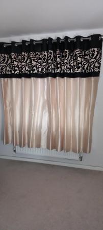 Image 2 of Black topped gold coloured lined curtains
