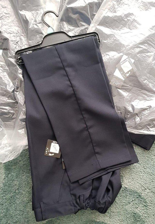 Preview of the first image of 2 Pairs NEW boys smart Navy trousers - Age 14-15yrs Chatham.