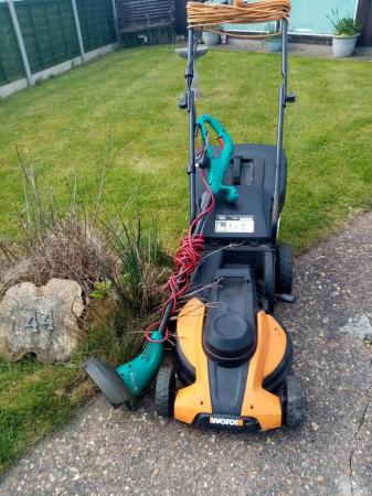 Image 1 of Worx electric lawn mower and Bosch strimmer.